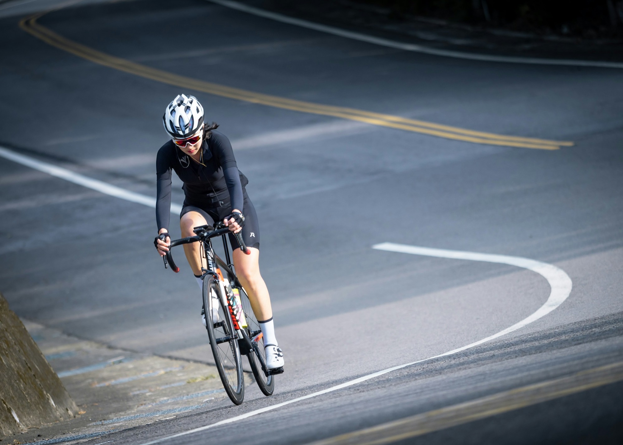 Woman road cycling — endurance nutrition for cyclists across British Columbia